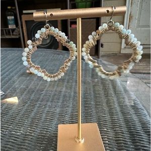 Gold earring with beads around